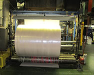 Laminating of Water Barrier Film to Absorbent Material for Personal Absorbent Products